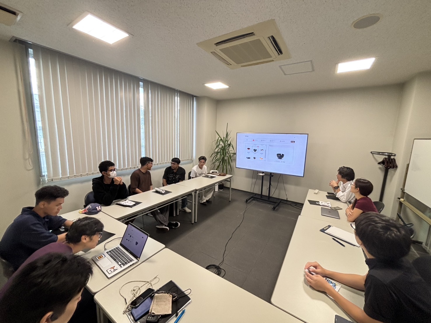 Participants in a DX project workshop and presentation